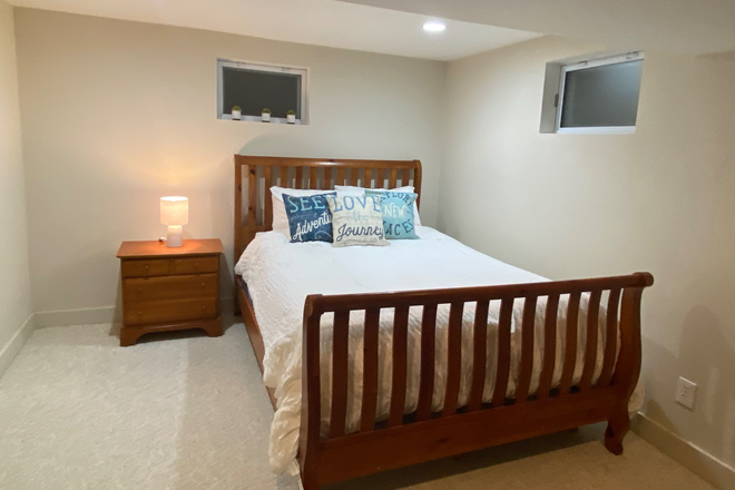 Large, master bedroom with walk in closet and storage - Basement apartment in house: Private bedroom, bathroom, living room, kitchenette