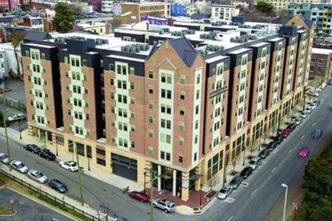 Complex from outside view - 8 1/2 Canal St, Sublease available Apartments
