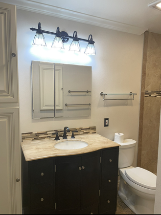 primary en suite sink and commode (master) - Laguna Hills Room in Condo