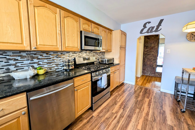 Fully stocked kitchen with stainless steel appliances - Move-In Ready! Fully Furnished 3BR/1BA Brick Home Near Regis – Rent by Bedroom, Utilities Included