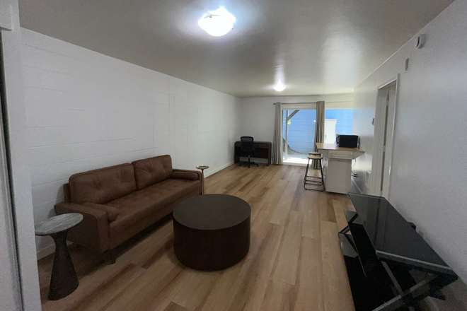 Living Room - Furnished 1-Bedroom 1-Bath Apartment with FREE parking and patio/deck in Prime Location