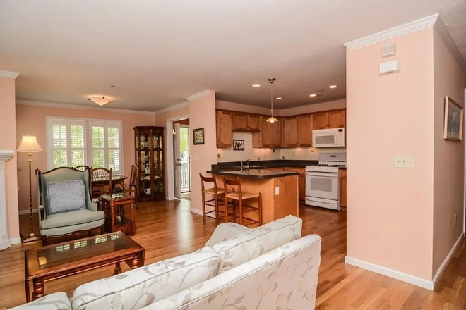 Living room looking towards dining area - Live in the heart of Arlington Center at sought-after Russell Place Condominiums!