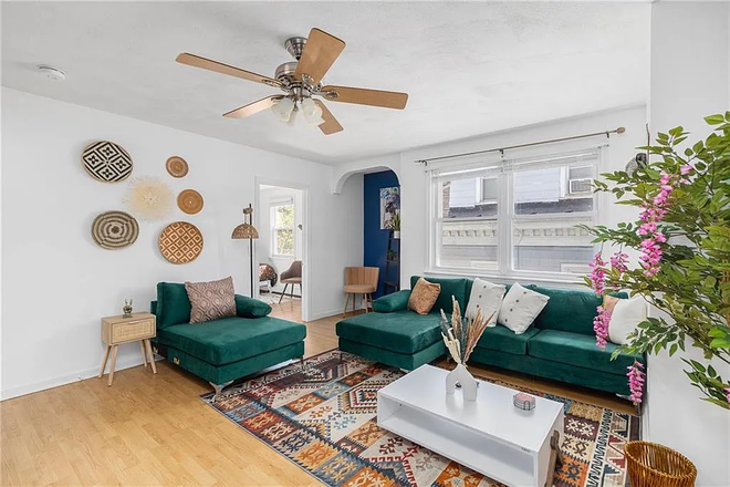 Living room - Furnished 4-Bedroom, 1 Mile from Campus | Private Parking | Water/Sewer Included | $3,200+ Apartments