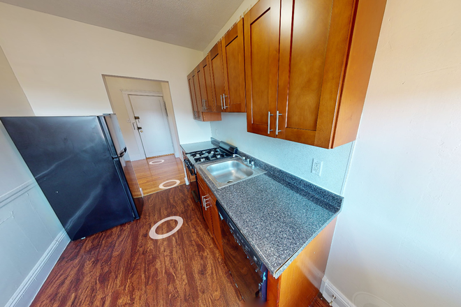 Visit hubrealtyproperties.com - Large studio with renovated kitchen and dishwasher, in Brighton Apartments