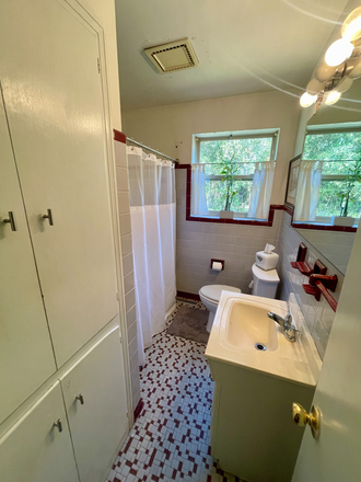 Bathroom with tub, shower, toilet, sink and storage closets. - Master Suite in Riverland Terrace, 10 min. to MUSC House