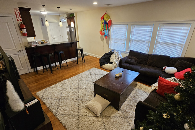 Livingroom, hardwood floors, open kitchen layout - Awesome 6 bed/ 2.5 bath Available 2027- Prime Location!! Duplex