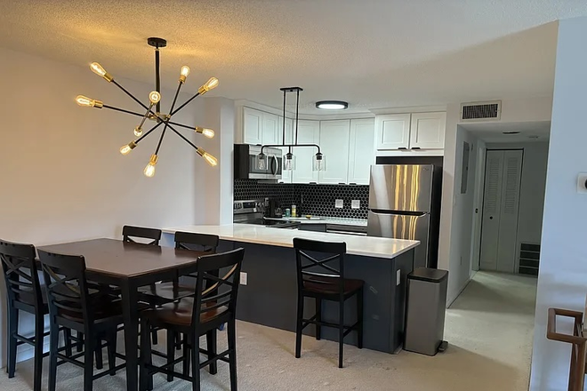 Kitchen and dining table - Furnished, Renovated Apt Next To Porter Square