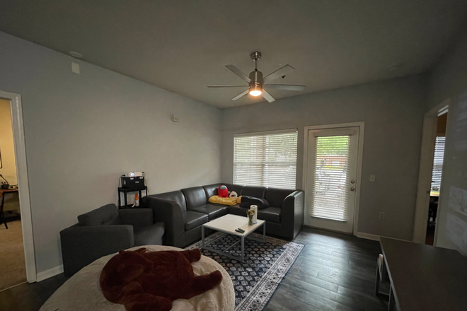 living room with outdoor patio door - Campus Edge Apartments