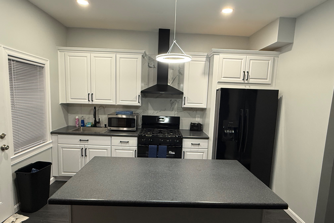 Kitchen - Newly renovated apartment close to train station, downtown, seaport, and South Bay