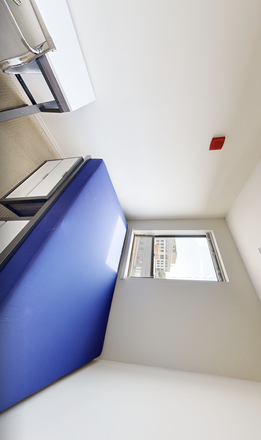 Bedroom bed and window (extra storage space and a full-size bed) - Terrapin Row Apartments