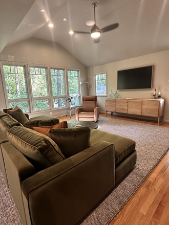 The great room has a 65" frame television, & streaming services are available with guests' own accounts. Google Fiber wifi throughout house. - Woodland Forest - Upscale 6 bedroom Home in East Chapel Hill