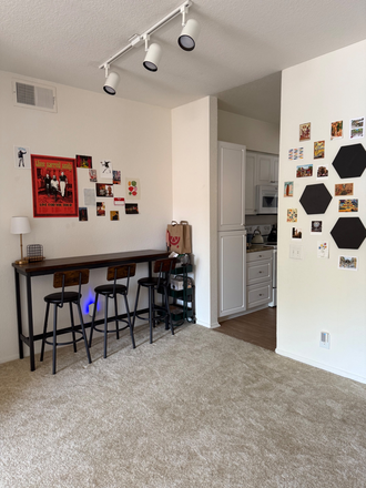 Dining area + kitchen entrance - San Mateo Apartments