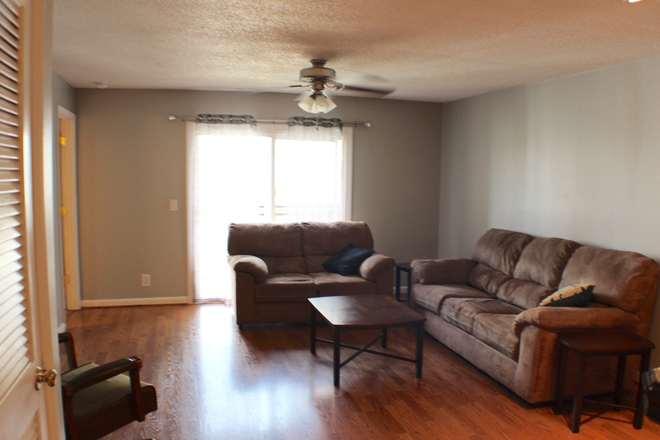 Living Room - Live Your Best College Life at Hunters Ridge! Pre leasing for the 26-27 year Condo