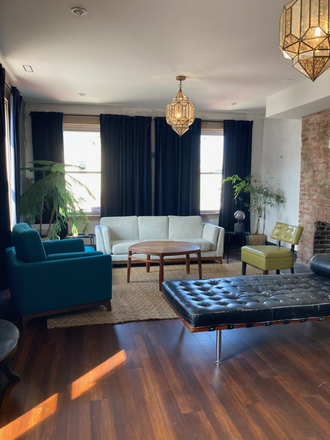 Living room with chandeliers - Furnished Apartment Close to UC Campus