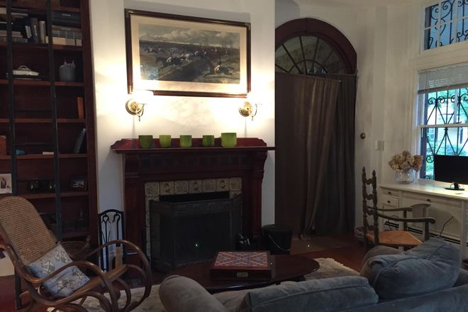 upstairs living room area and window out to porch (fireplace not working) - NEW! RARELY listed, furnished condo in lovely Harvard Square home, 4 months or longer