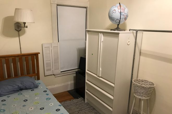 Wardrobe and window facing backyard - Small, cozy and inexpensive room in Davis Square, Somerville House