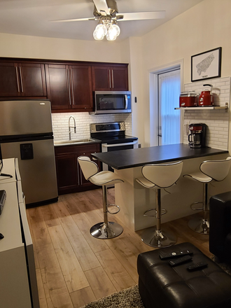 Kitchen with Island, seats 3 - Fully furnished, Modern, 1 Bedroom Apartment in Victorian Home