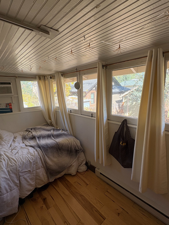 Bedroom with view of the large backyard - Sublet available in a charming, three bedroom home on The Hill