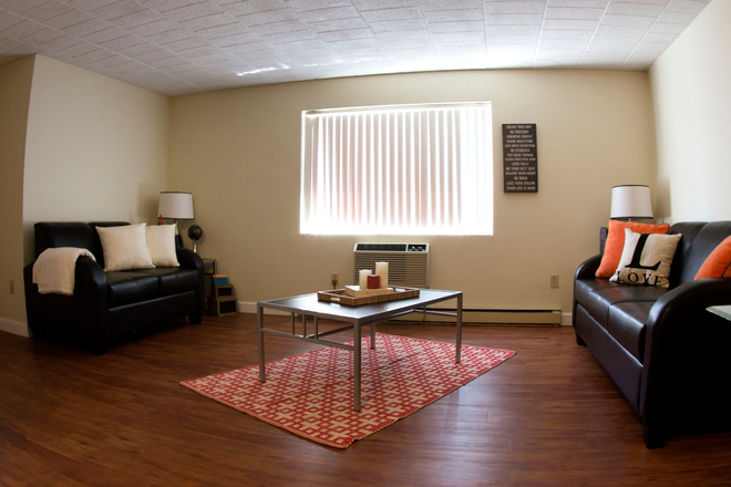 Living Room in a Two Bedroom - Collegiate Arms Apartments