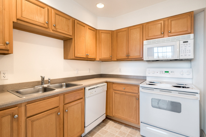 This is a kitchen in the building not my unit specifically (will be adding more photos of my unit later) - Biggs Building Apartments