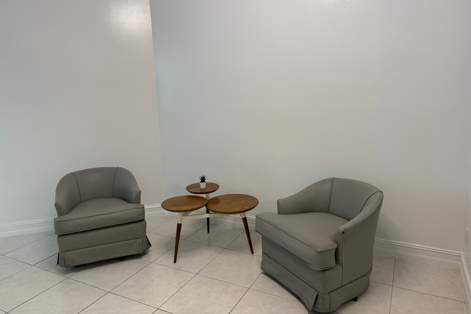 Living Room - Updated loft apartment near train & mall