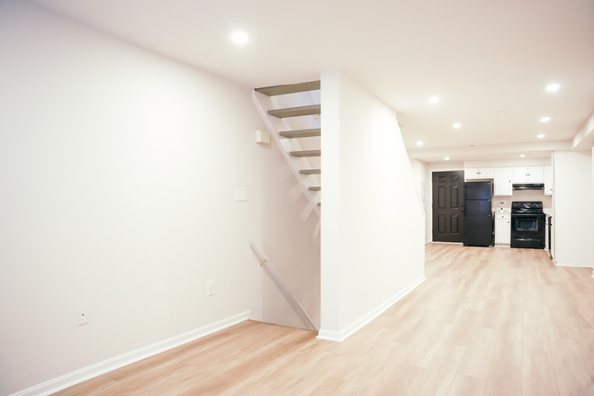 living room - Newly Updated 3BR/3BA Townhome w/ LVP, Modern Finishes — White Walls, Recessed Lights, Granite Tops