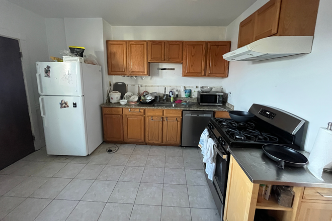 Kitchen - Four bedroom with two full bathrooms, central air conditioning and will have Laundry in unit Apartments