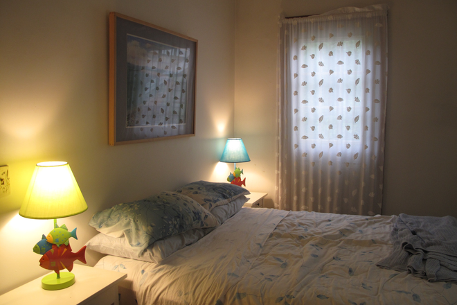 Bedroom with queen bed, next to large bathroom - Sunny, Furnished Westport Apartment (Rent Includes Utilities)