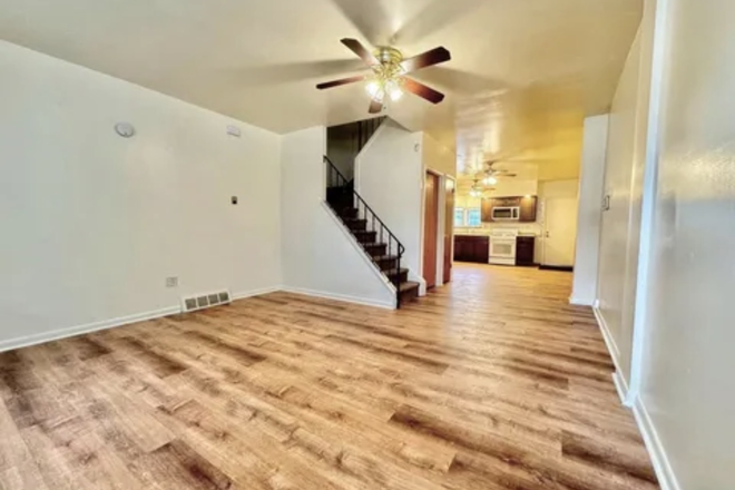 Living room view from front door - Beautifully Renovated Two-Bedroom Townhouse Near Temple University — $1,600/Month
