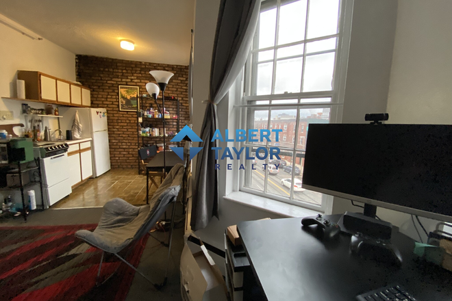 Living Area - Top-Floor Studio with Exposed Brick!! Apartments