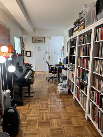 hallway with desk, piano and library - Large Two Bedroom Apartment in Peter Cooper Village
