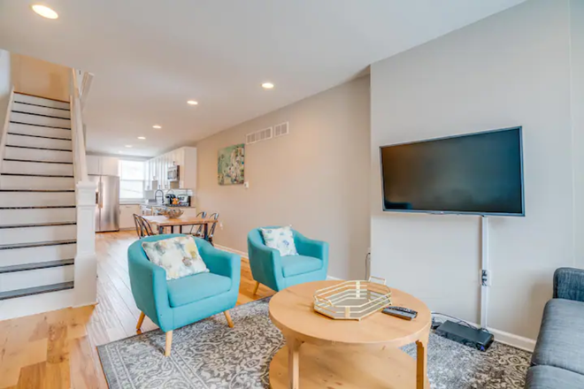 Open concept living - Four Blocks from Hopkins: Enjoy Furnished Living, Without Parking Worries Townhome