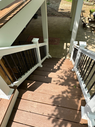 Stairway from the patio to the backyard - Beautiful Home in Old Greenbelt with new deck and patio. 1 block from town center and bus.