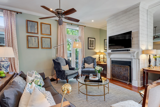 Spacious and open living room with gas fireplace. - Furnished Luxury Uptown Retreat Near Tulane & Freret – 4BR/3BA Duplex