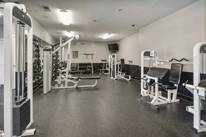 Communal clubhouse gym open 24/7 - Mountaineer Village Apartments