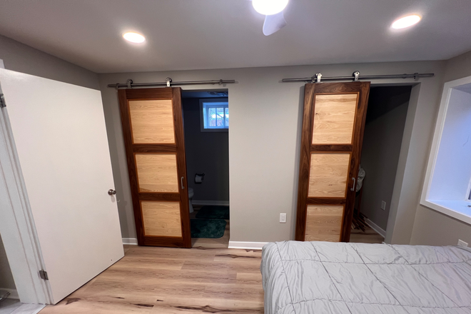 Bedroom view of the bathroom and closet — bedroom also has a 4 foot egress window. - Brand new renovated 1 bedroom basement private unit House