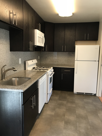 Kitchen - Cozy + Pet-friendly Building - 2133 Grant St. Apartments