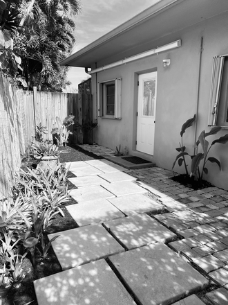 Garden patio area - Newly Furnished Modern 1 bedroom high ceiling studio near UM Apartments