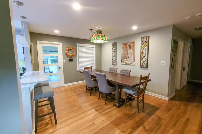 Dining room with door to sunroom - Charming 4 bedroom, 2 bathroom house in West Ashley, near Avondale