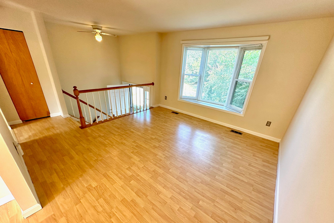 Gorgeous living room with bay window seat! - AVAILABLE AUG 2026! BEAUTIFUL, SPACIOUS, 5-BEDROOM HOUSE ACROSS STREET FROM CAMPUS! FREE PARKING!
