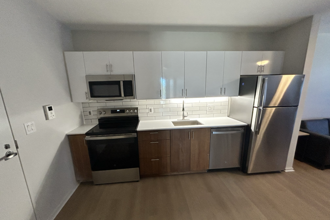 Kitchen/Entrance - Skybox Apartments