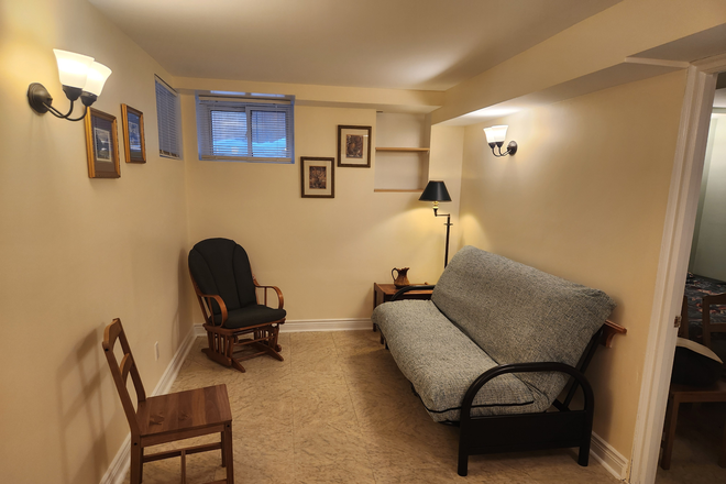 Living room, pull-out couch - 1 Furnished Bedroom steps from Broadview TTC, internet, laundry, utilities included. Apartments