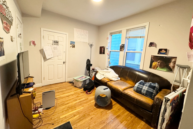 Living Room - Room Rental Available Now - Convenient Mission Hill 4 Bed | Walk to Orange and Green Lines | A/C Apartments