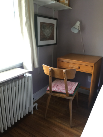 Bedroom: desk beside window with a view to the garden - Semi-private furnished 2nd floor unit, w/ kitchenette, natural light. Women only. Steps to bus stop. House