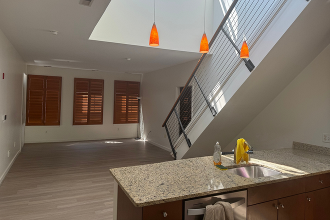 Kitchen and living room - Village Lofts Penthouse + Roof Deck