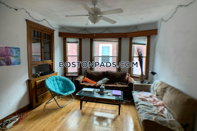 Living Room - NO BROKER FEE! 4 Bed 1 Bath Apartment on Frederick Ave.!