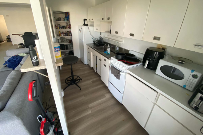 Full kitchen with refrigerator, microwave, and included countertop appliances - Furnished 2BR at 100 Memorial – Balcony & Charles River Views Apartments