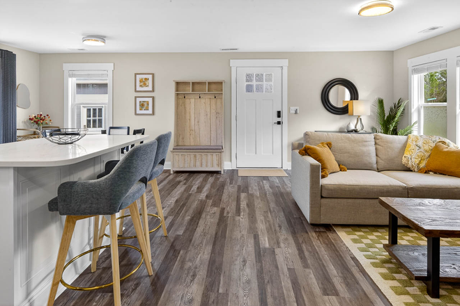 Entryway and open kitchen, dining, and living room - Cozy and Bright Home in Northeast Durham