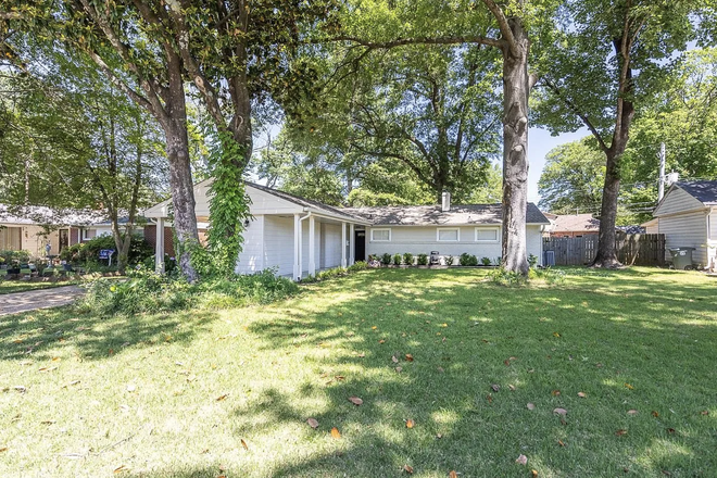 Front yard and elevation with carport - Updated East Memphis home