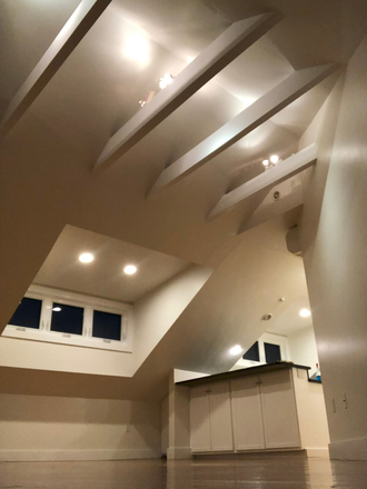 Cathedral ceilings, showing lighting at night - Modern 1 Bedroom in a Victorian building Apartments